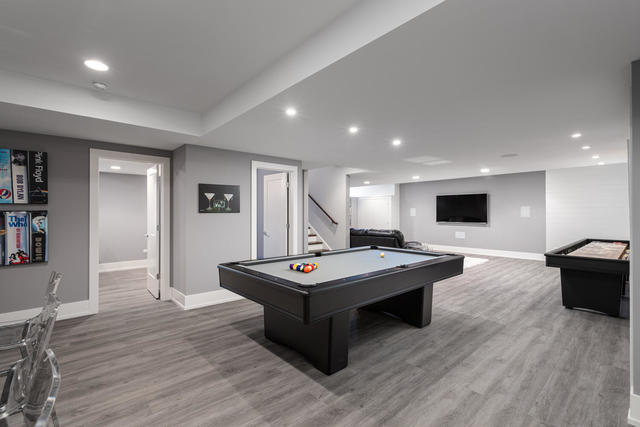 640 Wellner Road Naperville, IL 60540 - Photo 42 of 48 a living room with furniture pool table and flat screen tv