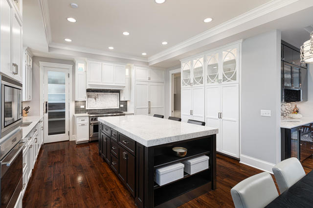 640 Wellner Road Naperville, IL 60540 - Photo 6 of 48 a kitchen with a stove a sink and a refrigerator