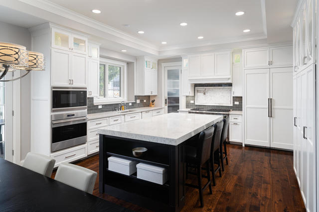640 Wellner Road Naperville, IL 60540 - Photo 7 of 48 a kitchen with a stove a sink and a refrigerator