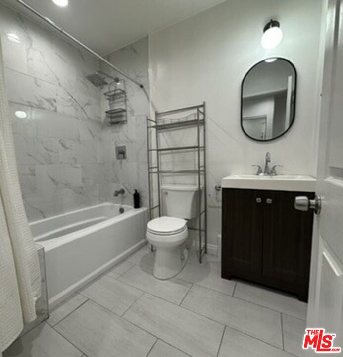 19542 Hart Street Reseda, CA 91335 - Photo 4 of 6 a bathroom with a sink toilet and shower