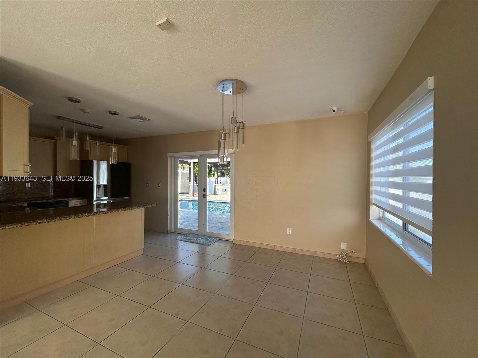 6202 Southwest 107th Avenue Miami, FL 33173 - Photo 7 of 22 a view of an empty room and window