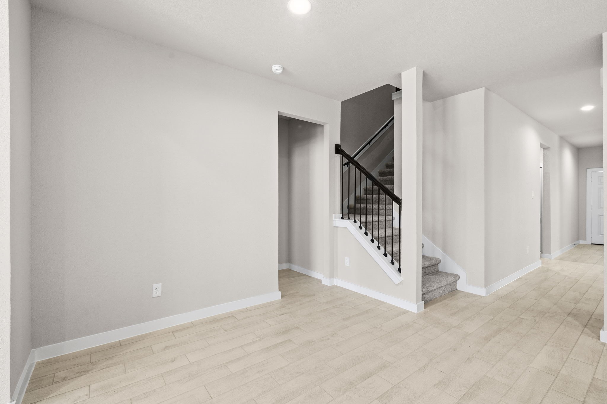 2571 Forest Cedar Lane Conroe, TX 77301 - Photo 15 of 42 a view of a hallway with staircase