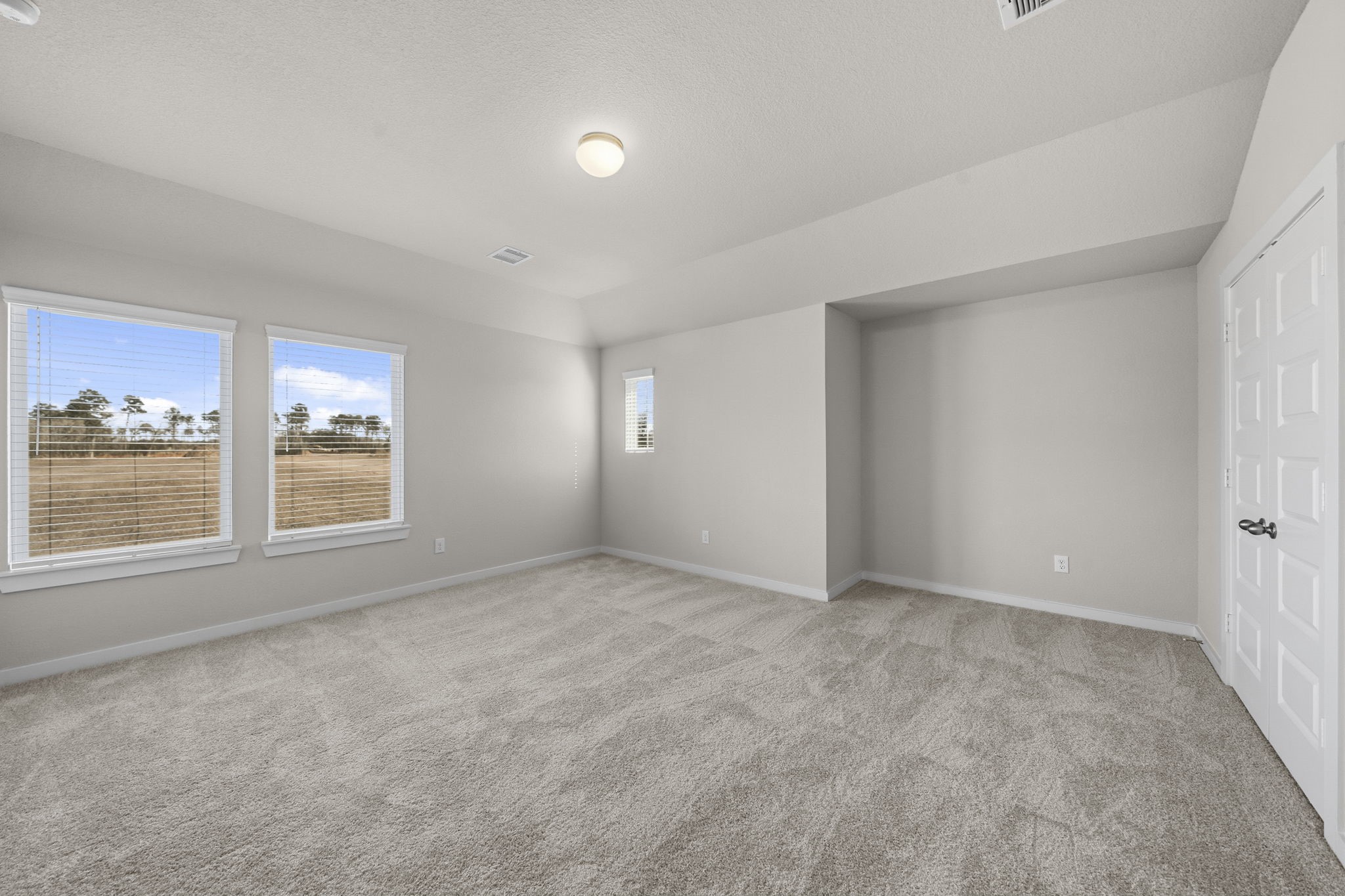 2571 Forest Cedar Lane Conroe, TX 77301 - Photo 23 of 42 a view of an empty room with a window