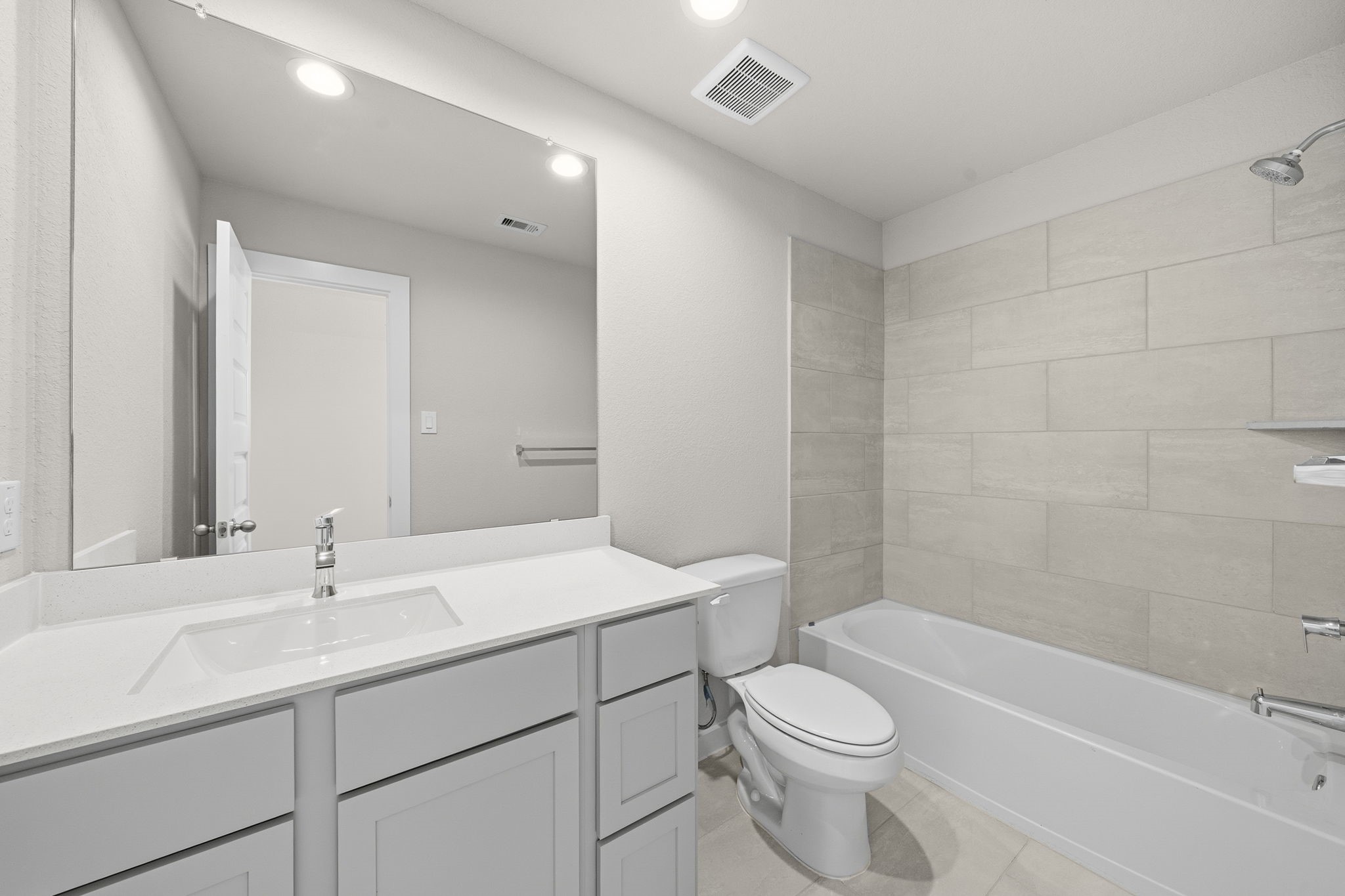 2571 Forest Cedar Lane Conroe, TX 77301 - Photo 29 of 42 a bathroom with a sink a toilet and shower