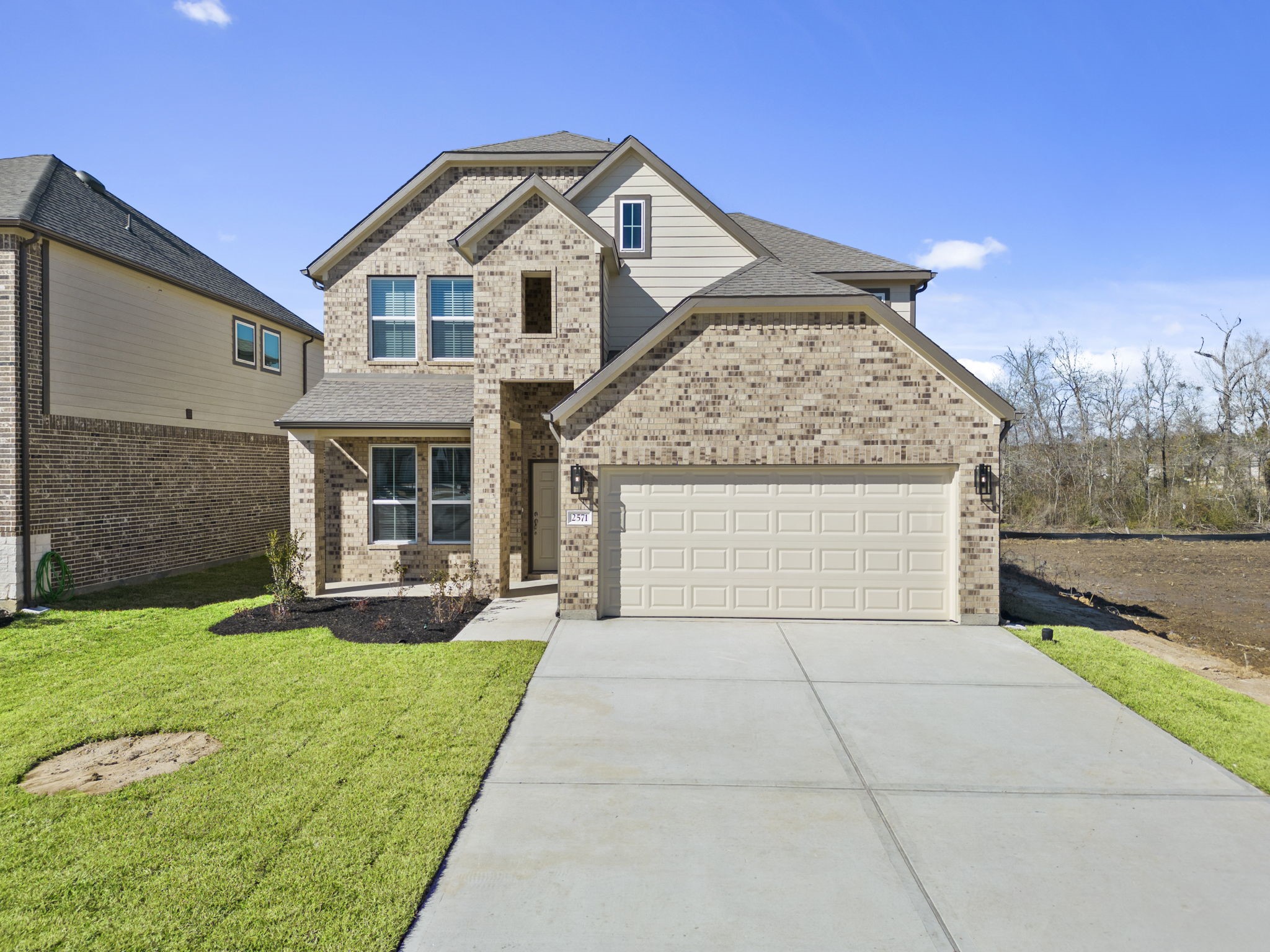 2571 Forest Cedar Lane Conroe, TX 77301 - Photo 38 of 42 a front view of a house with garden