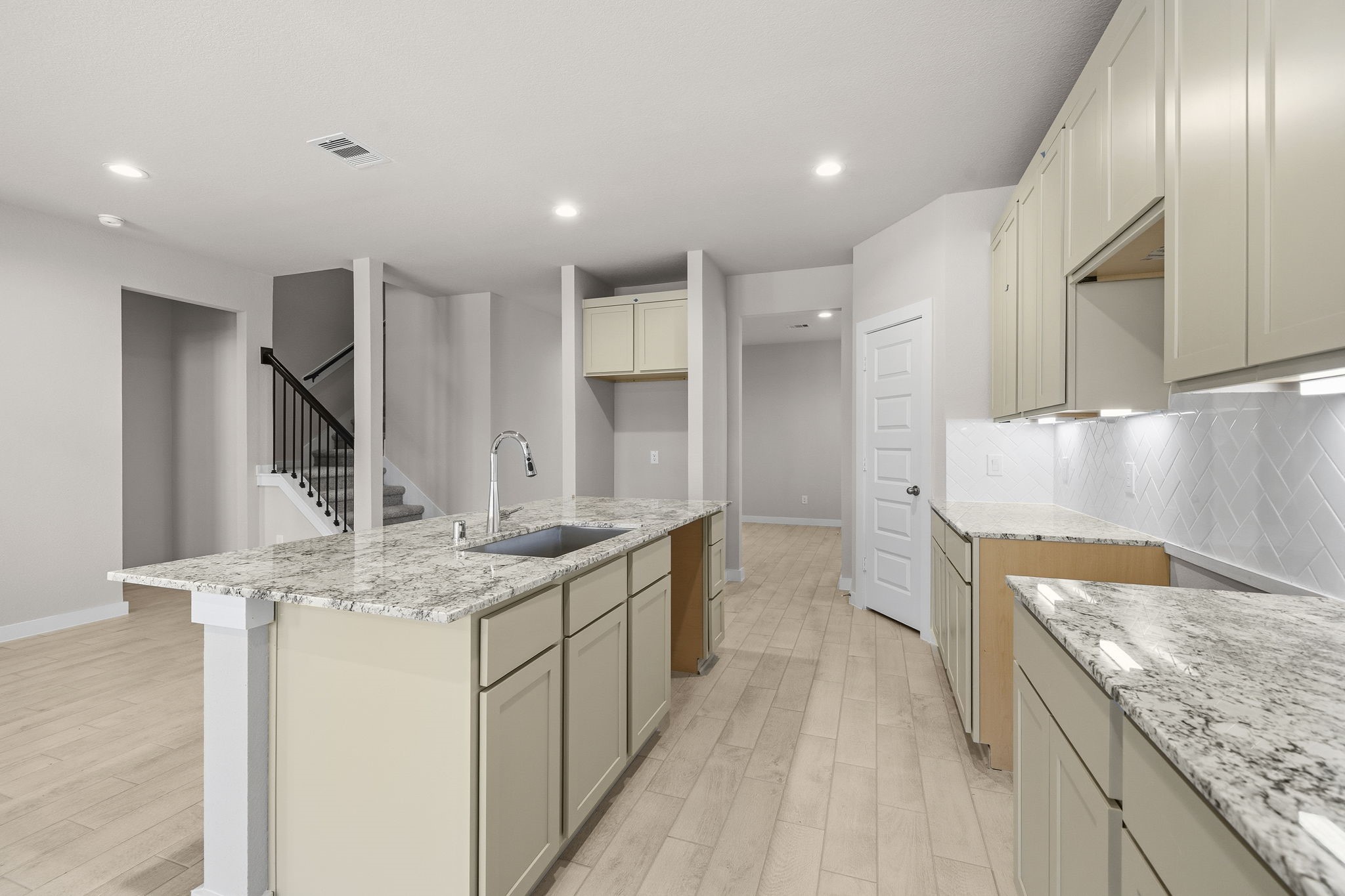 2571 Forest Cedar Lane Conroe, TX 77301 - Photo 5 of 42 a kitchen with stainless steel appliances granite countertop a sink and a refrigerator