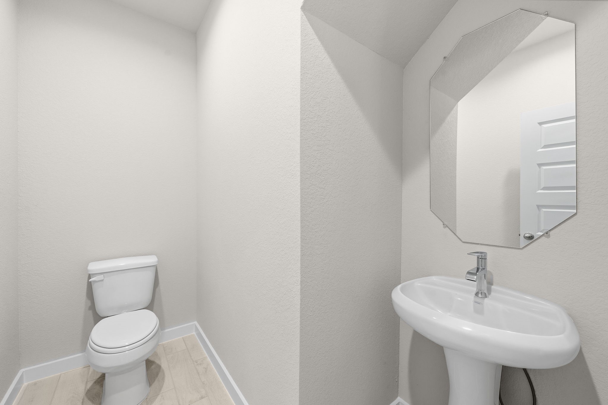 2571 Forest Cedar Lane Conroe, TX 77301 - Photo 9 of 42 a bathroom with a sink a toilet and a mirror