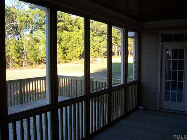 1028 Widgeon Way Raleigh, NC 27603 - Photo 8 of 8 Covered screened porch and large deck area!