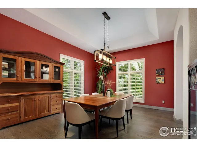 a view of a dining room with furniture and window