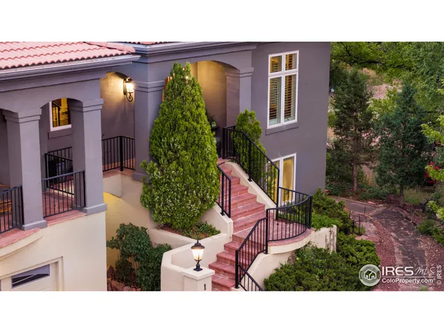 a picture of houses with yard and outdoor seating