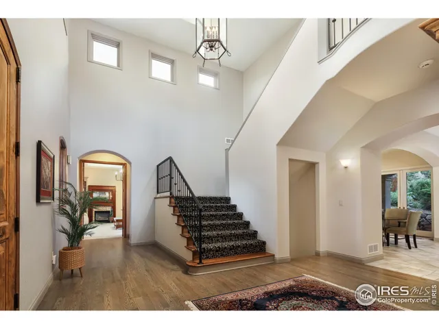 a view of a livingroom with furniture and staircase