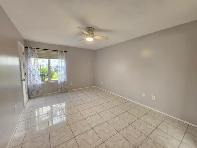 a bathroom with a granite countertop sink a large mirror and vanity
