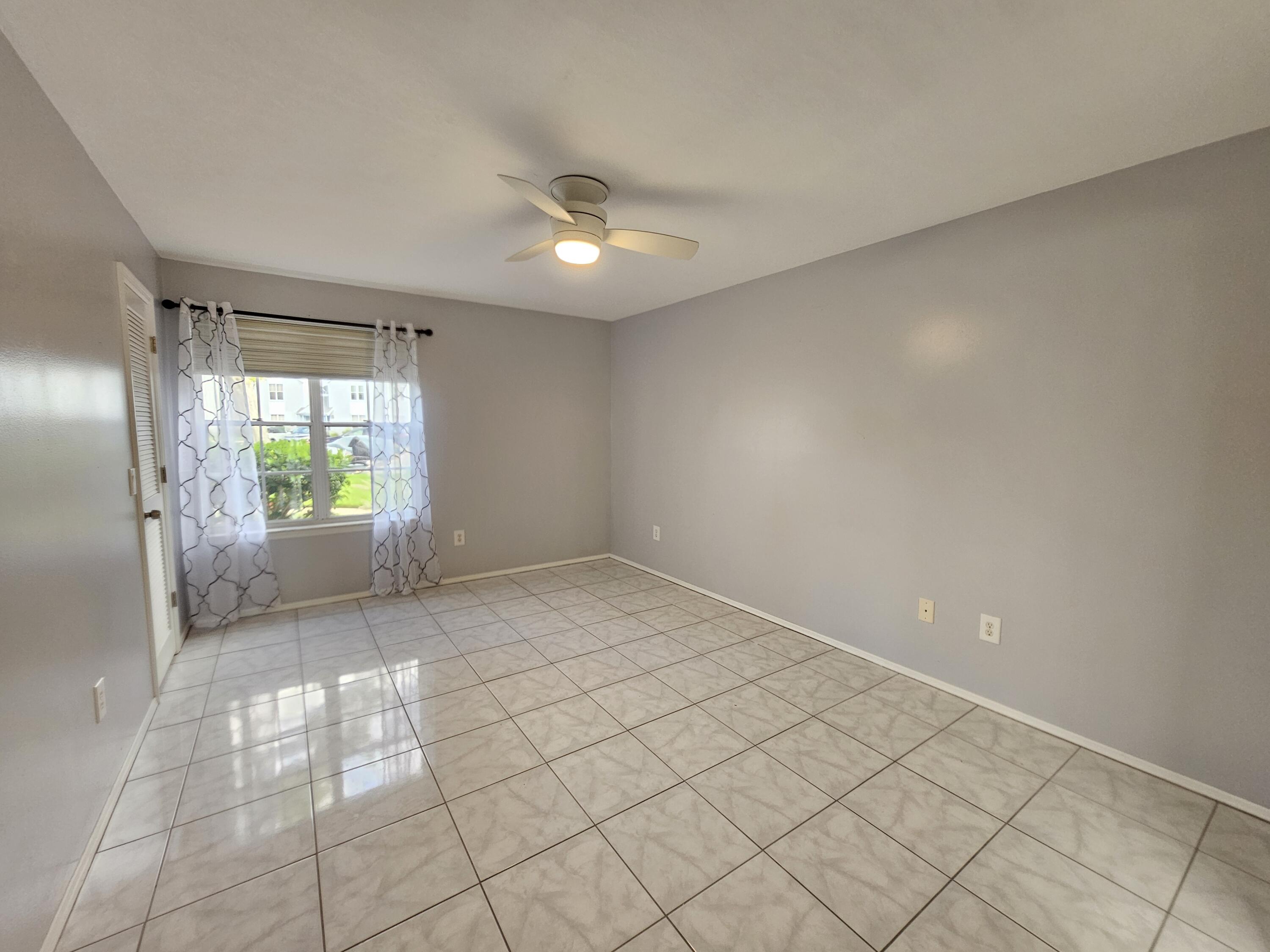 7330 N Highway, Unit 102 Cocoa, FL 32922 - Photo 13 of 26 a view of an empty room and window