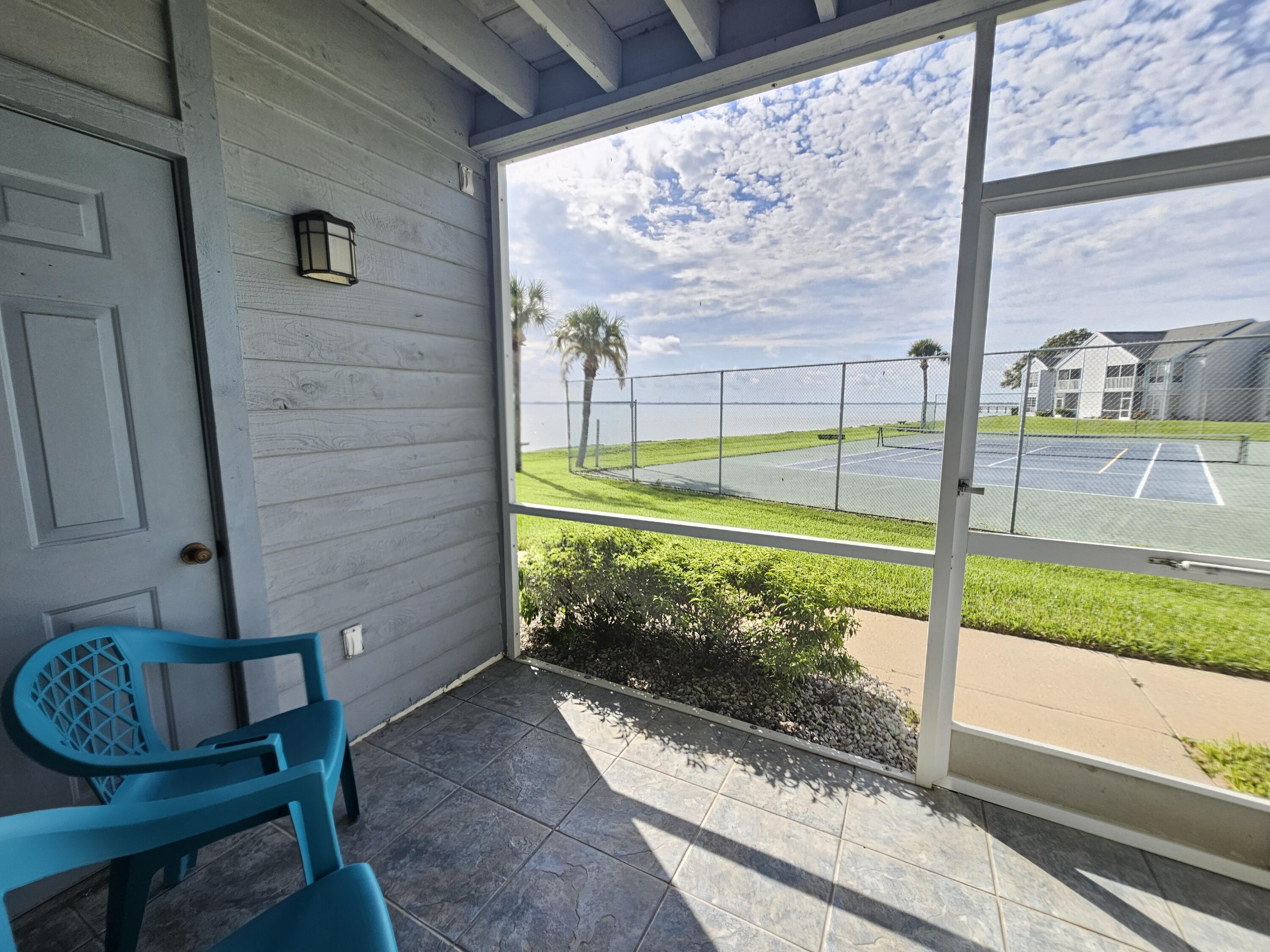 7330 N Highway, Unit 102 Cocoa, FL 32922 - Photo 22 of 26 a view of a porch with a yard