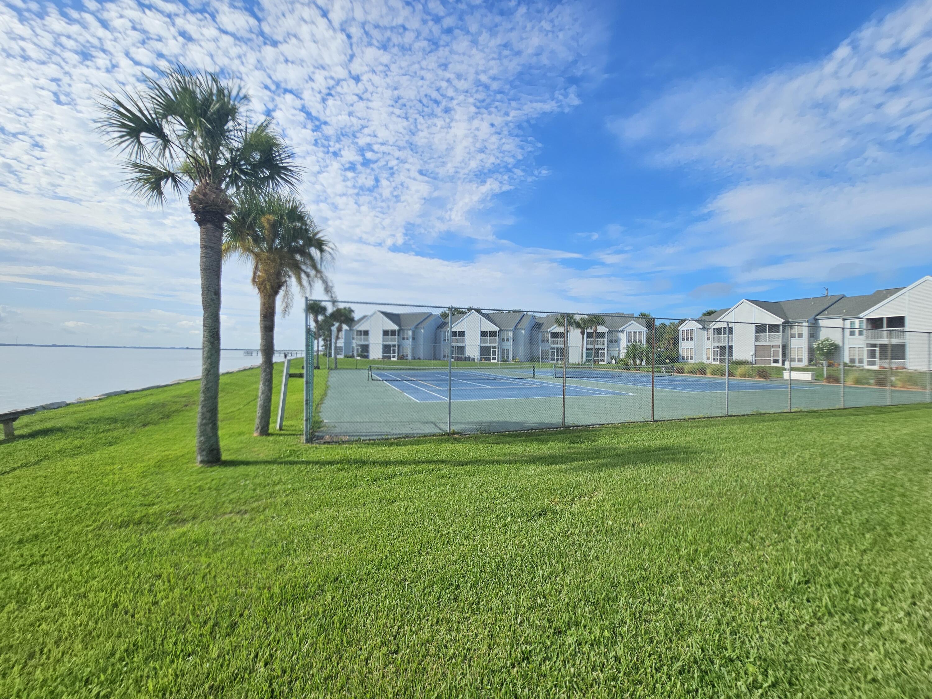 7330 N Highway, Unit 102 Cocoa, FL 32922 - Photo 23 of 26 a view of a garden and basketball court