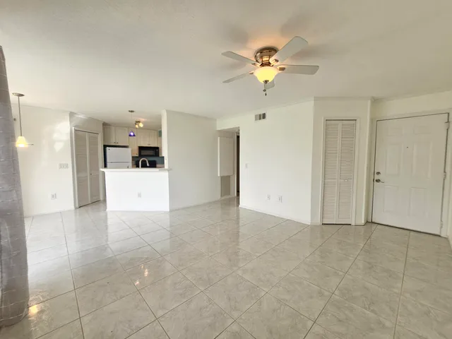 a view of a livingroom with a kitchen