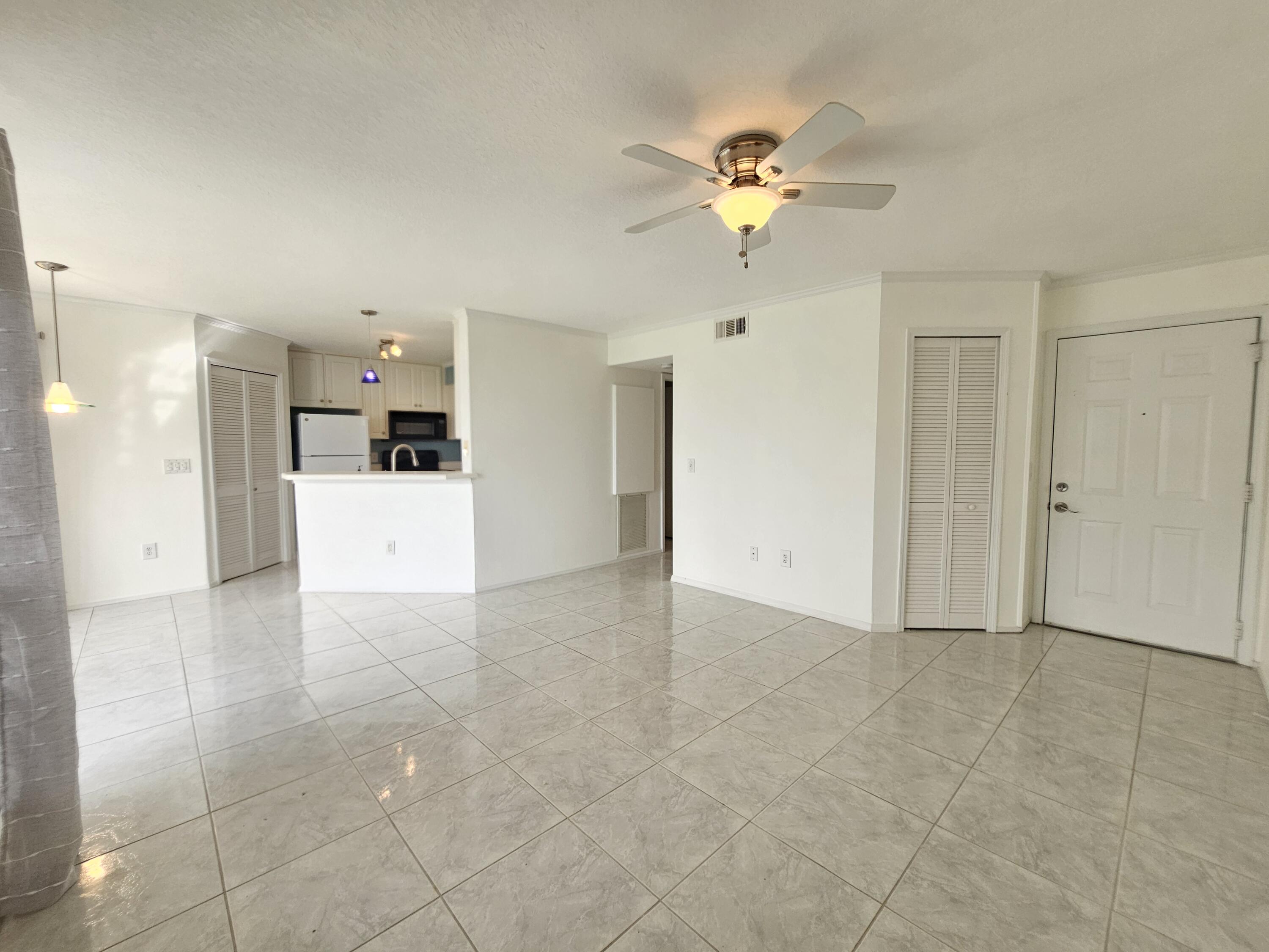7330 N Highway, Unit 102 Cocoa, FL 32922 - Photo 3 of 26 a view of a livingroom with a kitchen