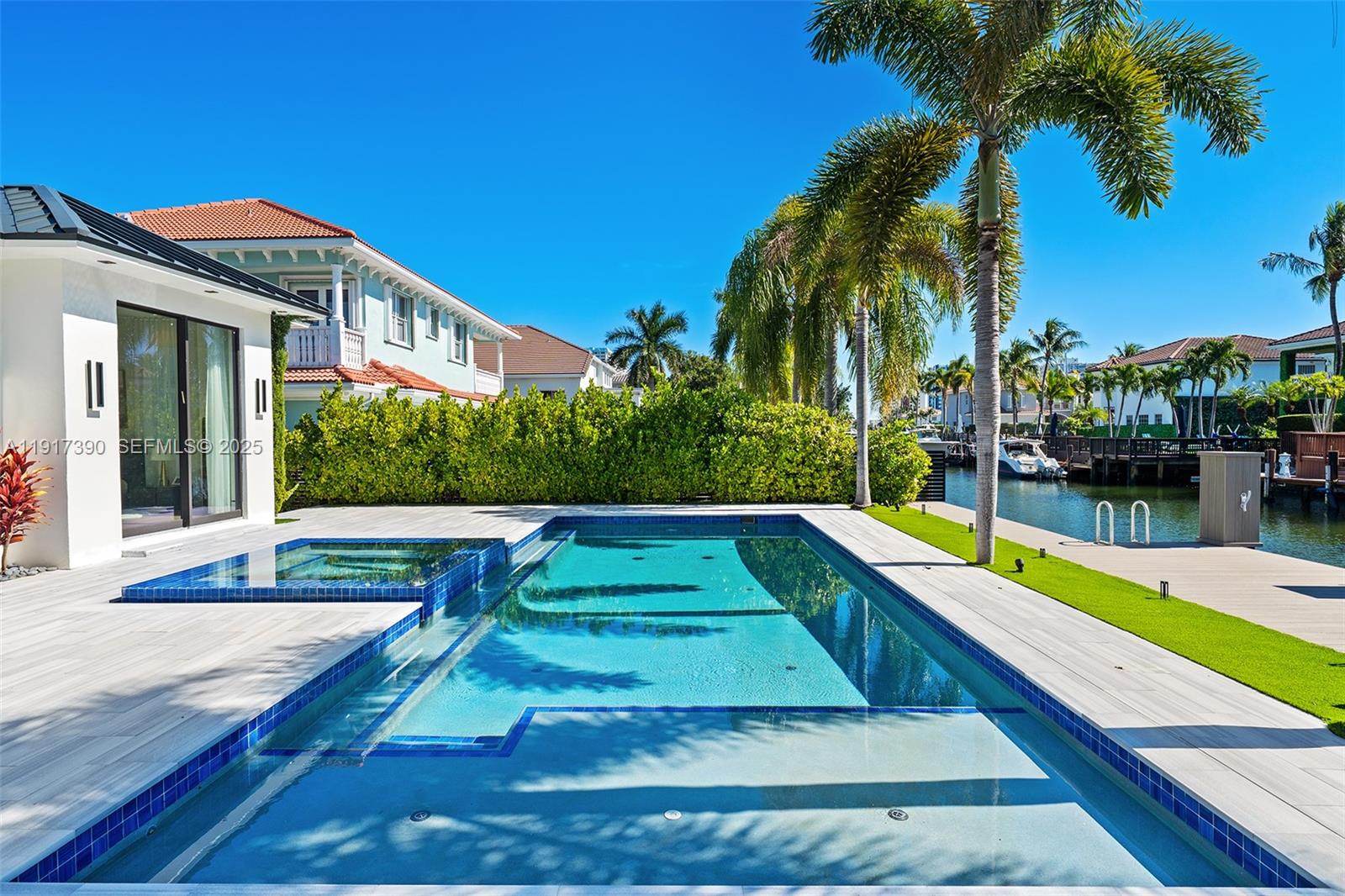 900 Washington Street Hollywood, FL 33019 - Photo 50 of 61 a view of swimming pool with a yard and palm trees