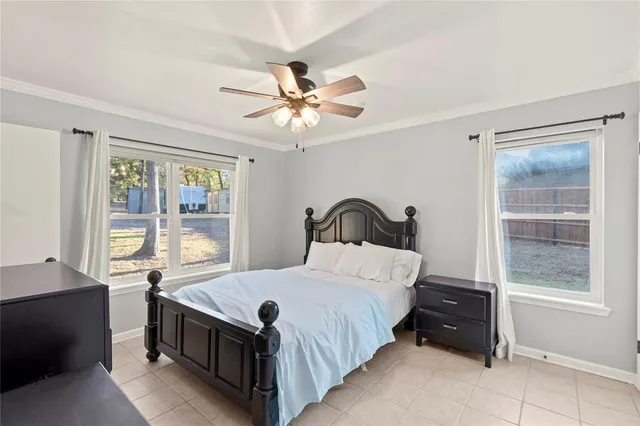 a bedroom with a large bed and a window