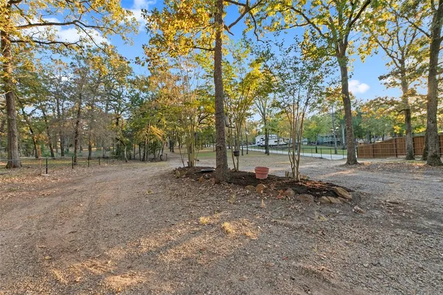 a backyard of a house with yard and outdoor seating