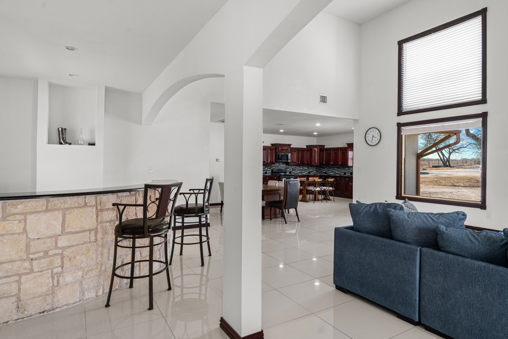 1206 Walter Hoffman Road Cedar Creek, TX 78612 - Photo 22 of 40 a living room with furniture and a large window