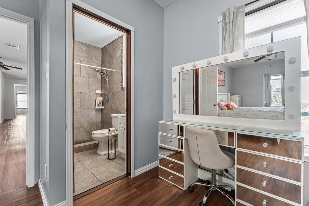 1206 Walter Hoffman Road Cedar Creek, TX 78612 - Photo 32 of 40 a kitchen with a table and chairs in it