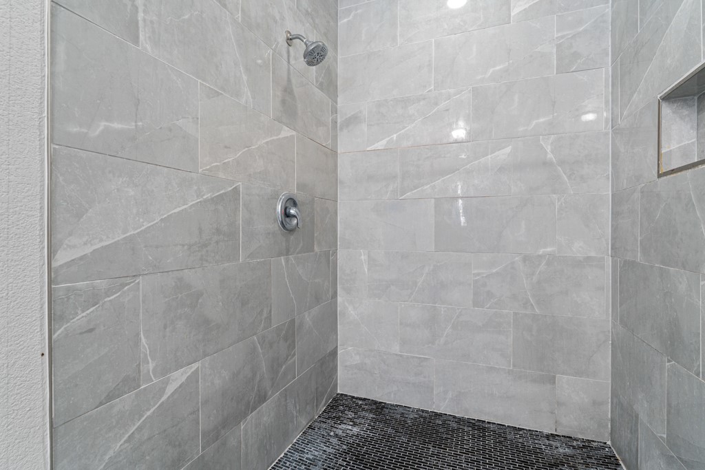 1206 Walter Hoffman Road Cedar Creek, TX 78612 - Photo 38 of 40 a bathroom with a shower