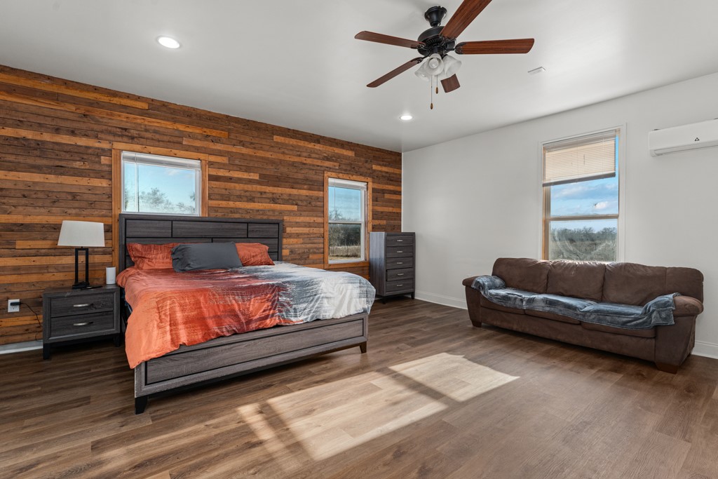 1206 Walter Hoffman Road Cedar Creek, TX 78612 - Photo 40 of 40 a bedroom with a bed a couch and a window