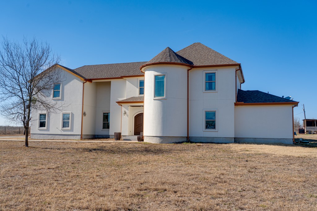 1206 Walter Hoffman Road Cedar Creek, TX 78612 - Photo 4 of 40 a front view of a house with a yard