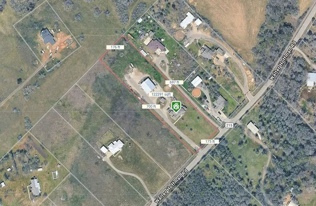 a living room with furniture and a lamp