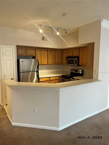 a view of a livingroom with a ceiling fan and window