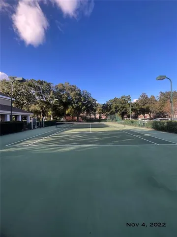 a view of a room with gym equipment and a large window