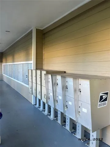 a view of sign board with a garden