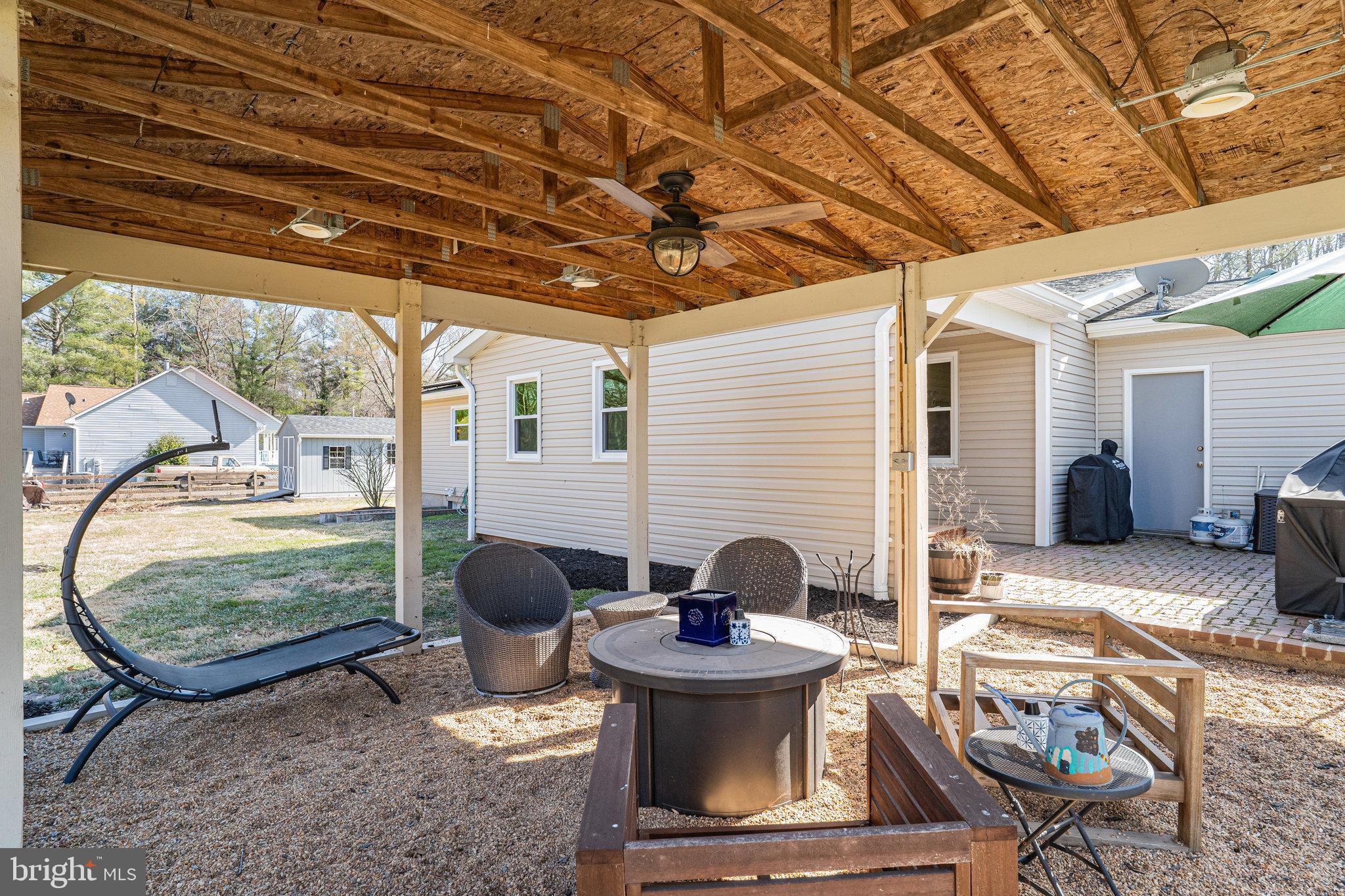 9353 Meetze Road Midland, VA 22728 - Photo 25 of 36 Covered Back Yard Seating Area