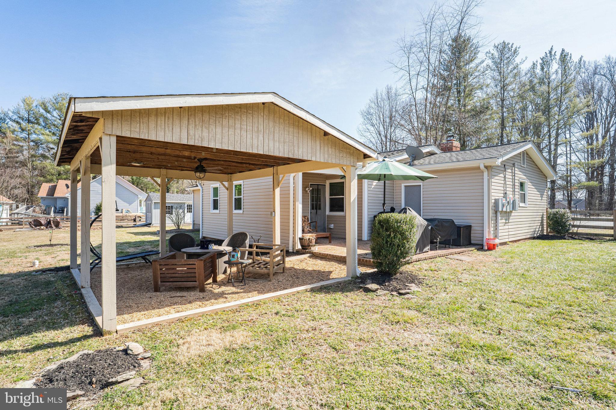 9353 Meetze Road Midland, VA 22728 - Photo 26 of 36 Covered Back Yard Seating Area