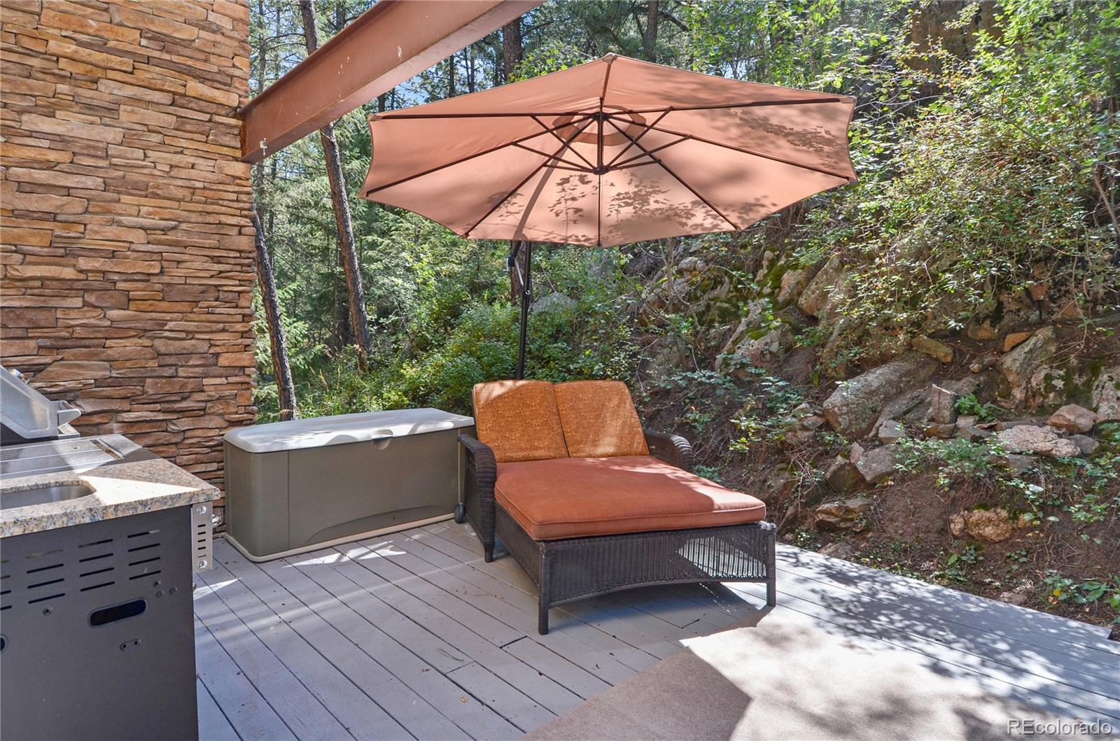 3074 High Road Evergreen, CO 80439 - Photo 11 of 40 a sitting area with furniture and wooden roof