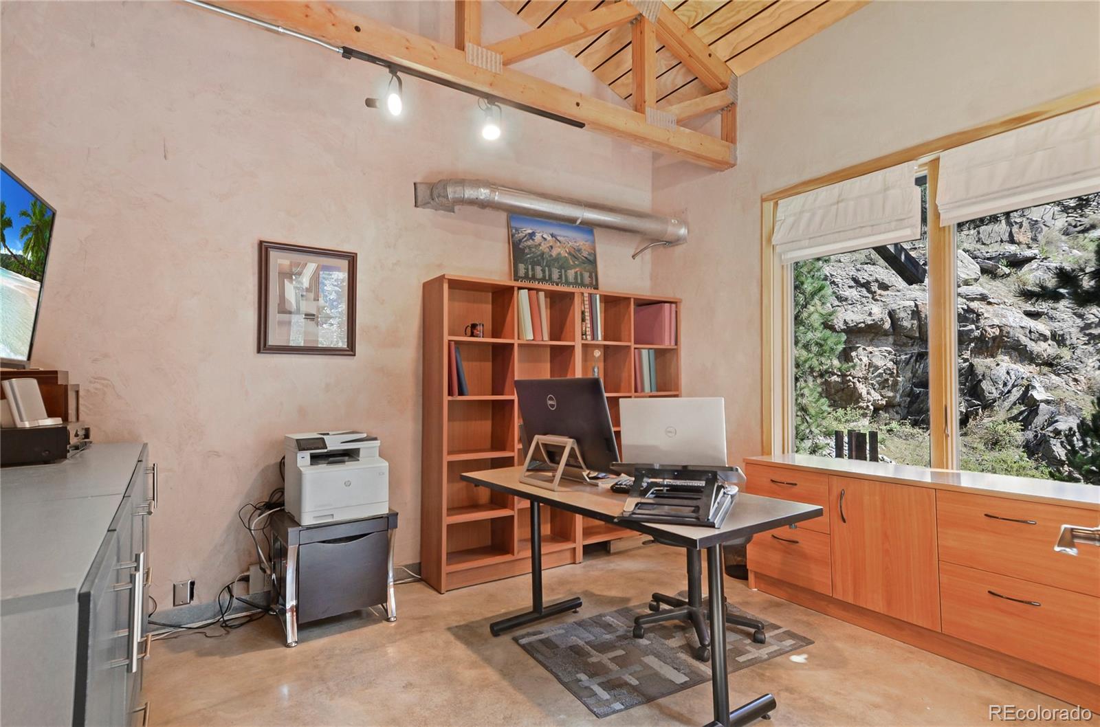3074 High Road Evergreen, CO 80439 - Photo 15 of 40 a workspace with furniture and window