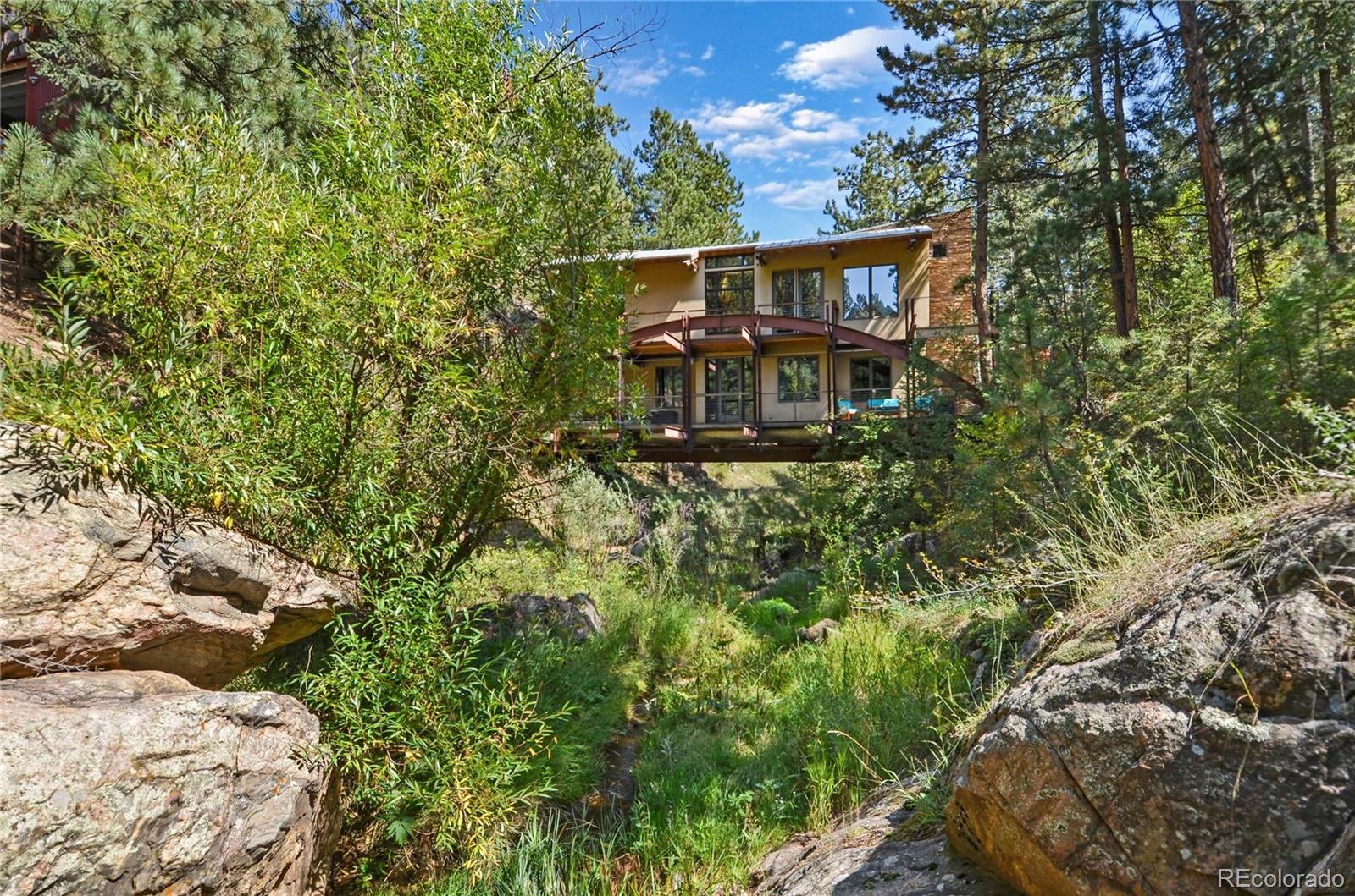 3074 High Road Evergreen, CO 80439 - Photo 3 of 40 a view of a house with a yard