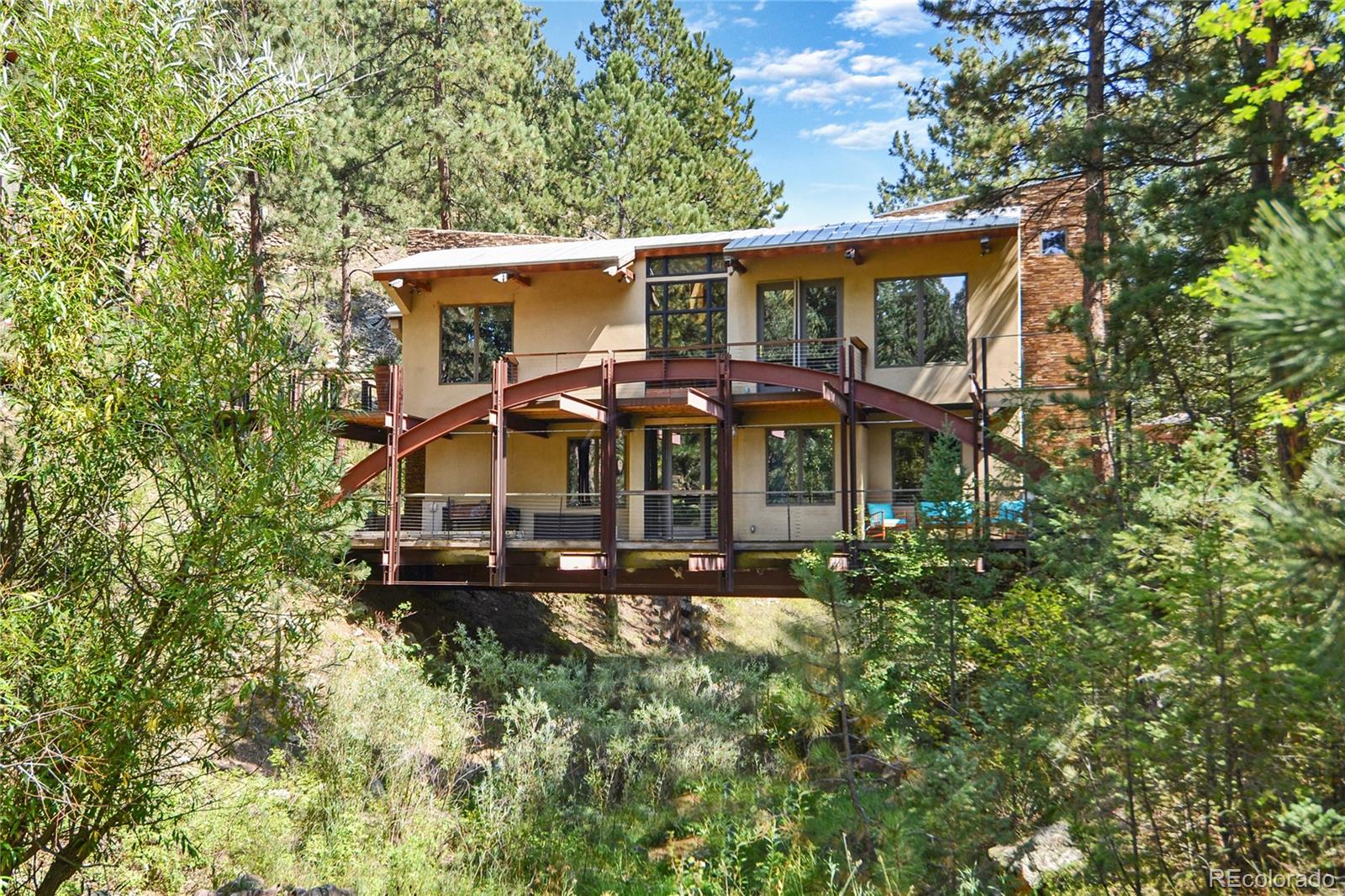 3074 High Road Evergreen, CO 80439 - Photo 34 of 40 an aerial view of a house with a yard