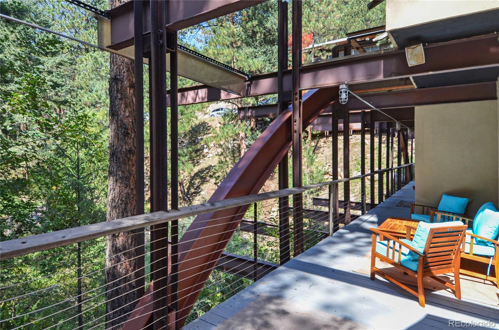 3074 High Road Evergreen, CO 80439 - Photo 5 of 40 a view of balcony with wooden floor and outdoor seating