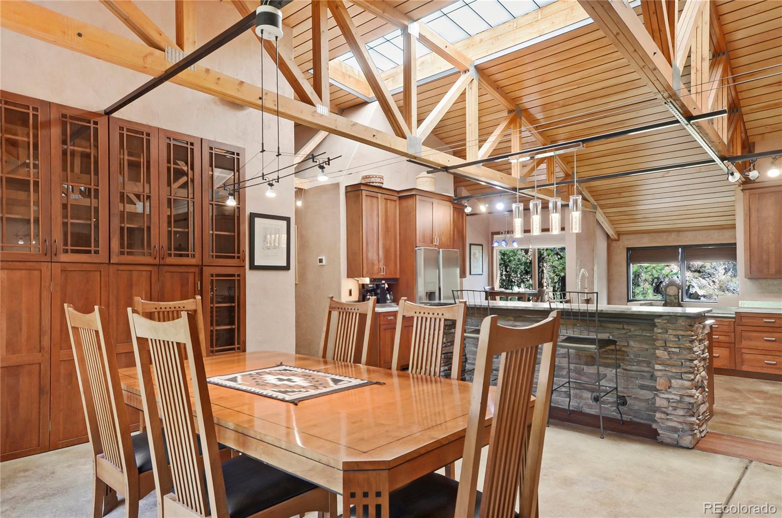 3074 High Road Evergreen, CO 80439 - Photo 9 of 40 a view of a dining room with furniture window and outside view