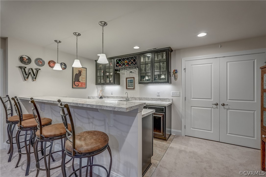 13119 Rodington Court Midlothian, VA 23113 - Photo 35 of 49 a kitchen with kitchen island a breakfast area stove shower and sink