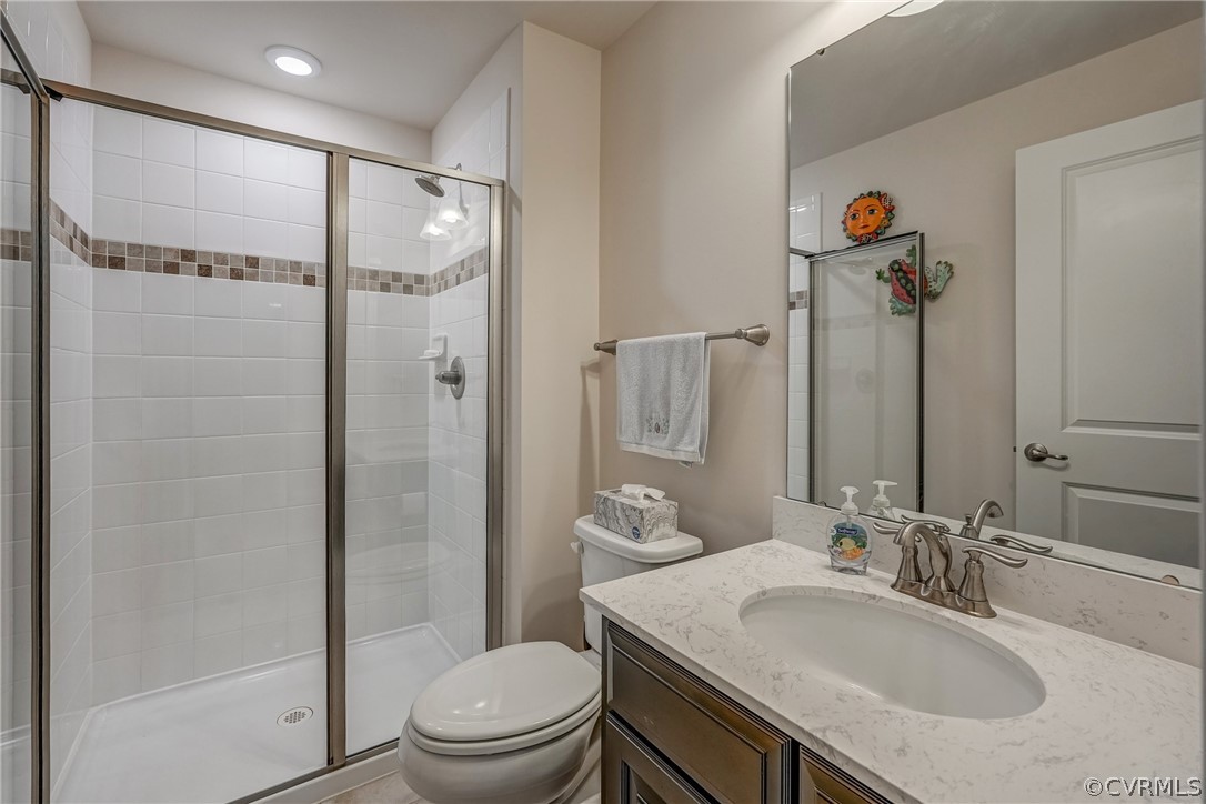 13119 Rodington Court Midlothian, VA 23113 - Photo 37 of 49 a bathroom with a granite countertop sink toilet and shower
