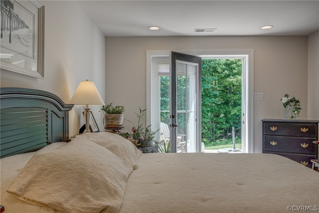 13119 Rodington Court Midlothian, VA 23113 - Photo 41 of 49 a bedroom with a bed a window and potted plant