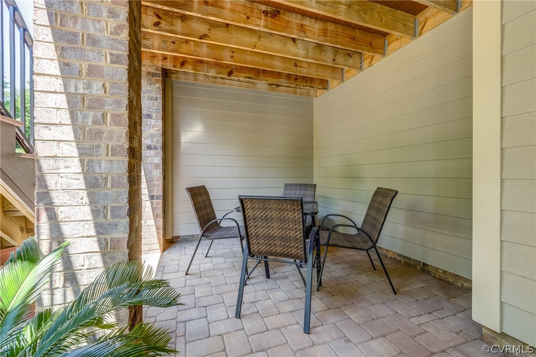 13119 Rodington Court Midlothian, VA 23113 - Photo 43 of 49 a patio with table and chairs and potted plants