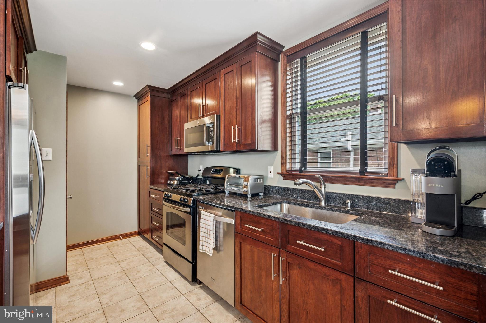 945 Springhaven Road Springfield, PA 19064 - Photo 3 of 28 Updated kitchen: cherry cabinets, granite tops