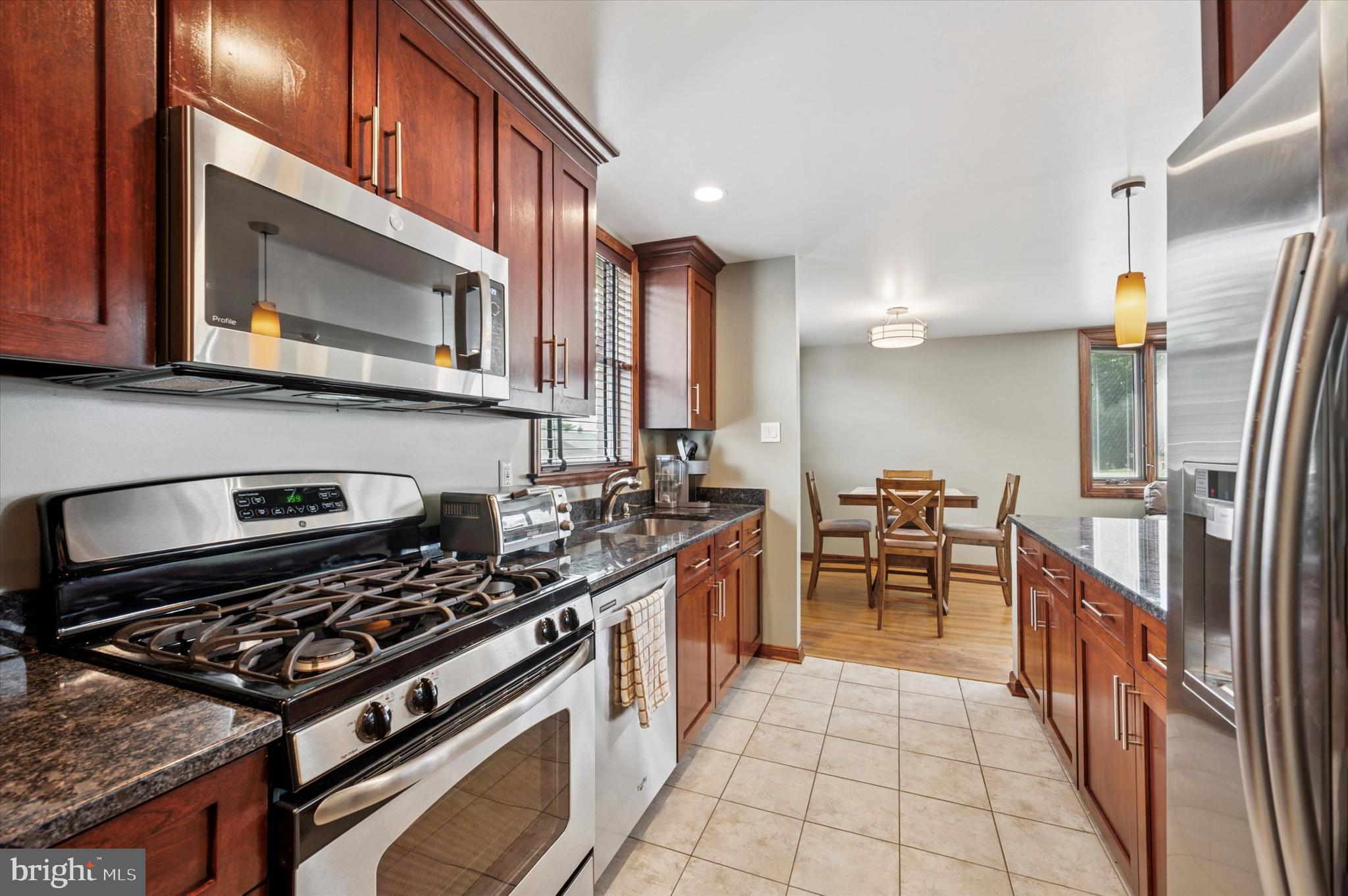 945 Springhaven Road Springfield, PA 19064 - Photo 4 of 28 Cherry cabinets, granite tops, ceramic floor