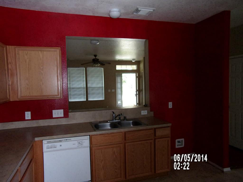 23823 Single Oak Street Spring, TX 77373 - Photo 6 of 10 a bathroom with a sink a mirror and a window