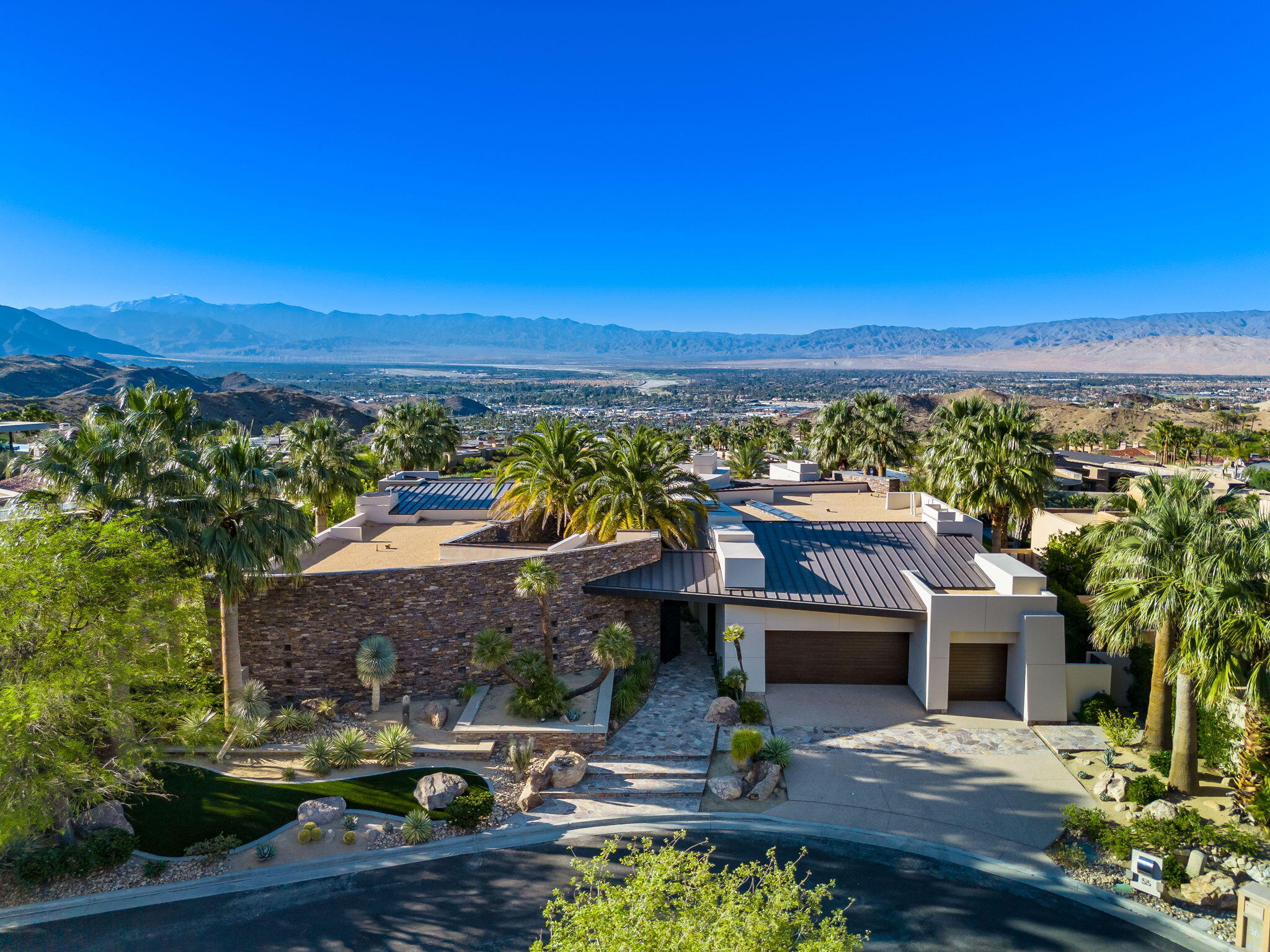 a view of houses with outdoor space and swimming pool