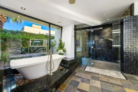 a bathroom with a bathtub and a shower